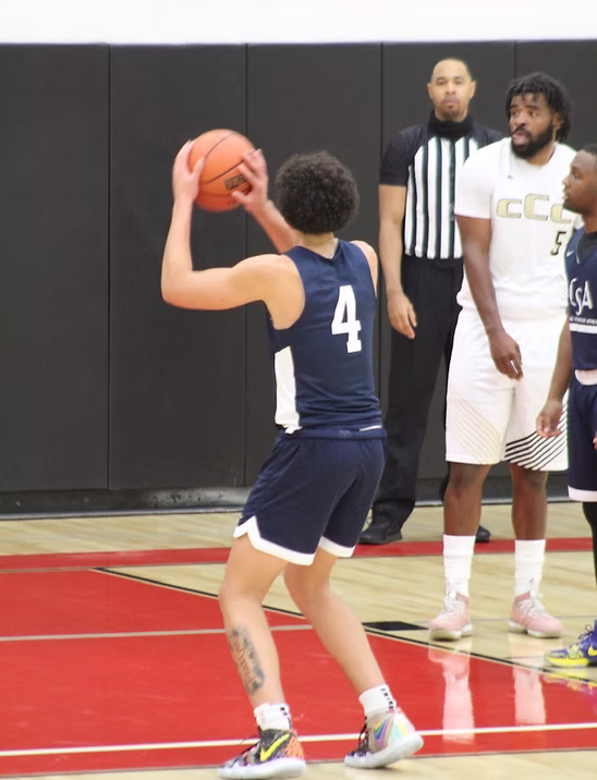A basketball player takes a shot during a game featured on the former Wesley website